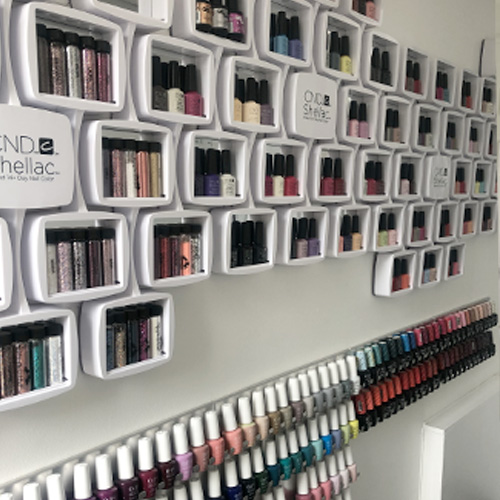 A Display of beauty products including nail polish and skin care products