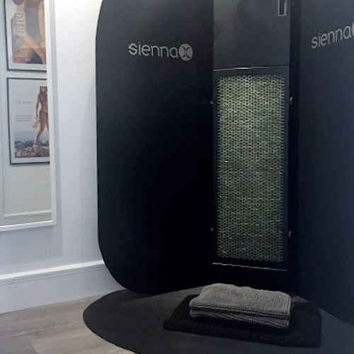 A black Sienna X Spray tan booth